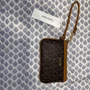 Brand new authentic Calvin Klein wristlet.